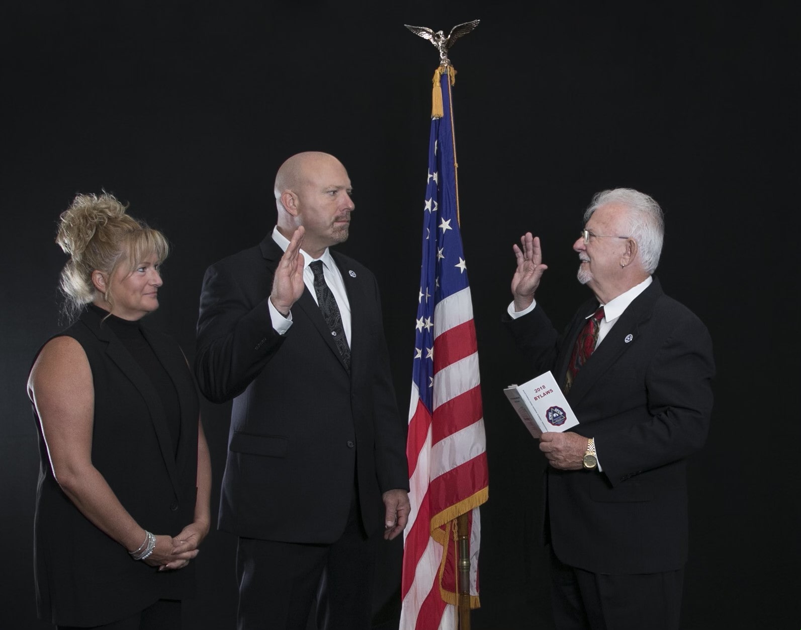Recorder Chuck Denny swearing in new Council President Lance Heasley (with his wife Lisa as witness).